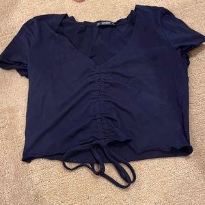 Navy cropped shirt, lightly worn